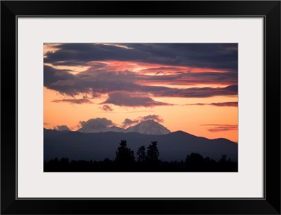 Clouds gather around the South and Middle Sisters at sunset, Bend, Oregon.