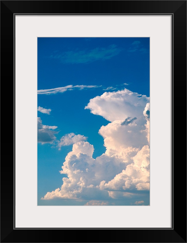 Cumulus clouds in a blue sky.