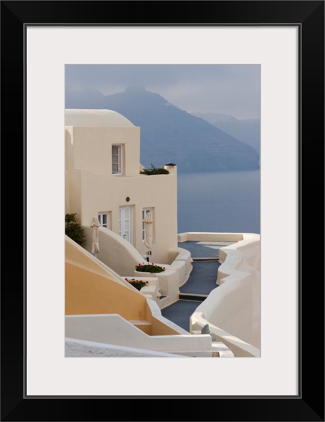 Europe, Greece, Santorini, Thira, Oia. Pathway to end villa overlooking the sea.