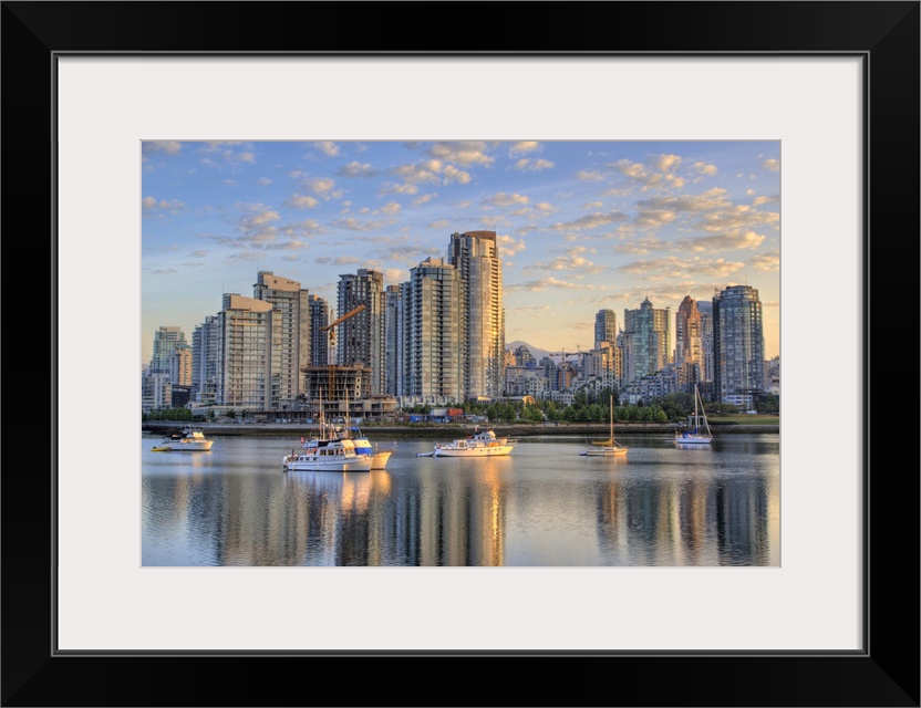 Looking across False Creek at the skyline of Vancouver British Columbia at sunrise