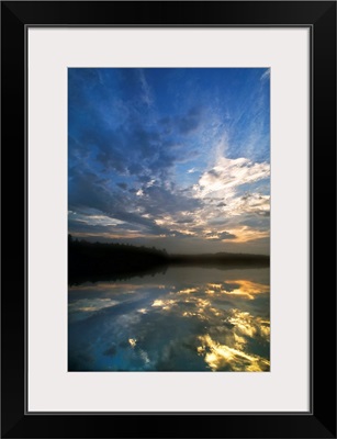 Michigan, Upper Peninsula. Sunrise sky reflected in Pete's Lake