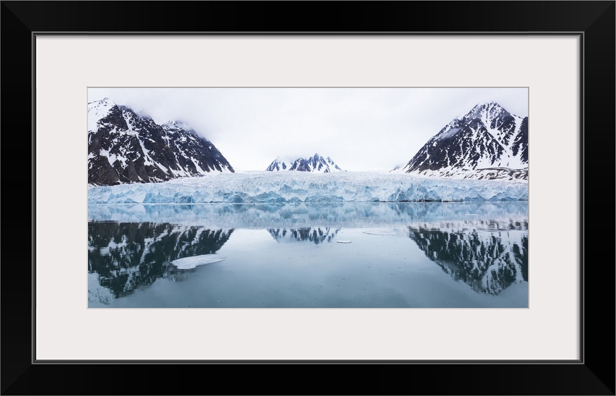 Norway, Svalbard, Monacobreen glacier, Reflections of mountains and glacier.