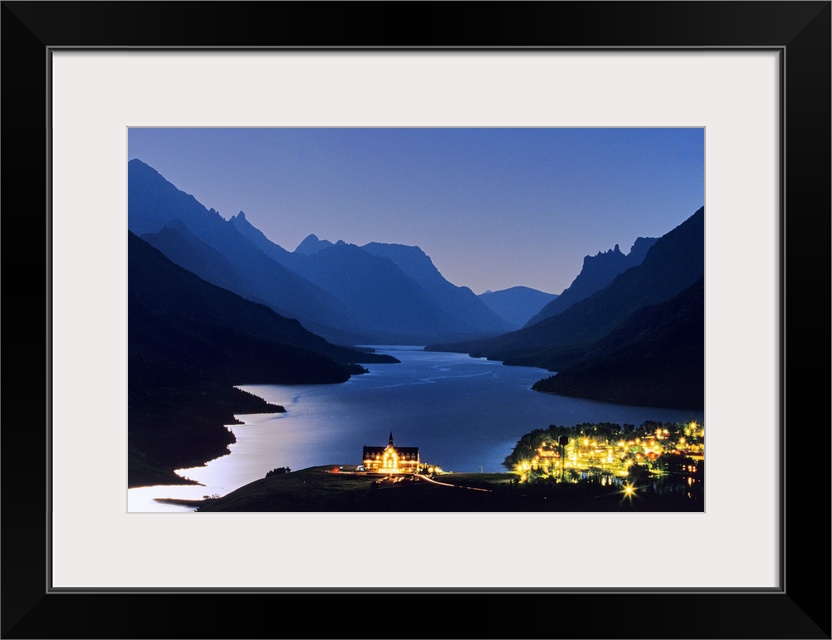 Prince of Wales Hotel and townsite in Waterton Lakes National Park in Alberta Canada under full moonlight