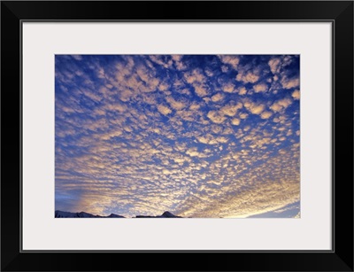 Puffy clouds at sunrise, Canadian Rockies in Banff National Park, Alberta