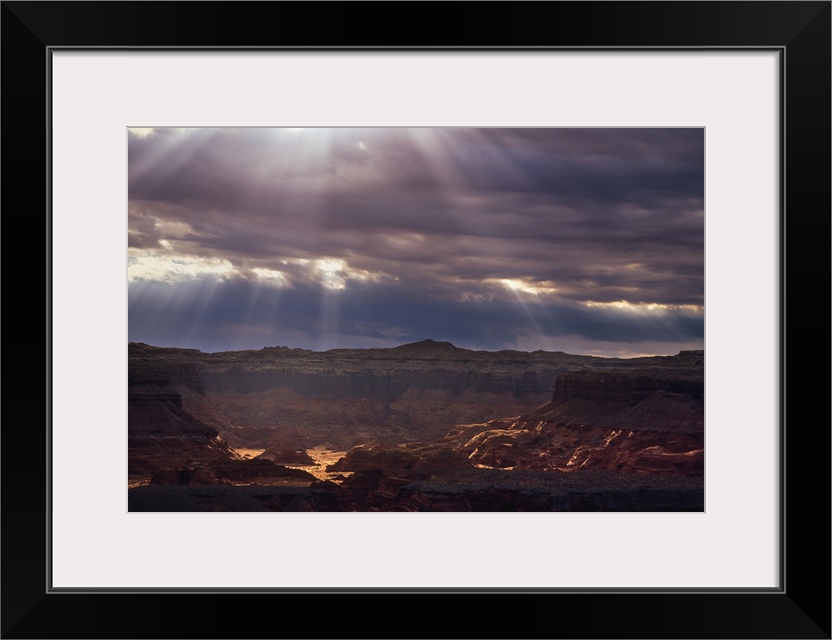 Sunrays into red rock canyon, Utah