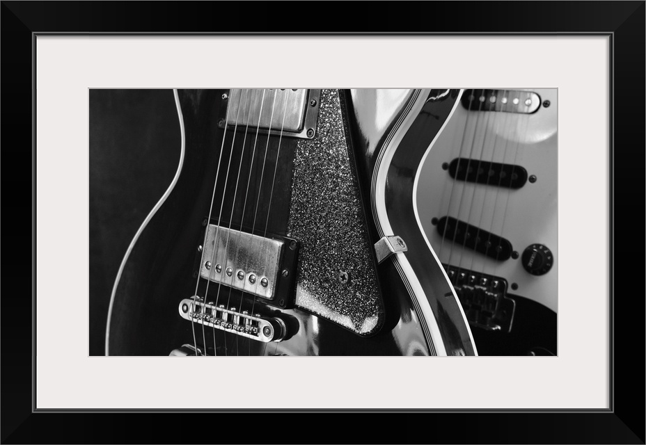 Electric guitar closeup on dark background.