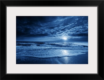 Midnight Blue Coastal Moonrise With Dramatic Sky And Rolling Waves