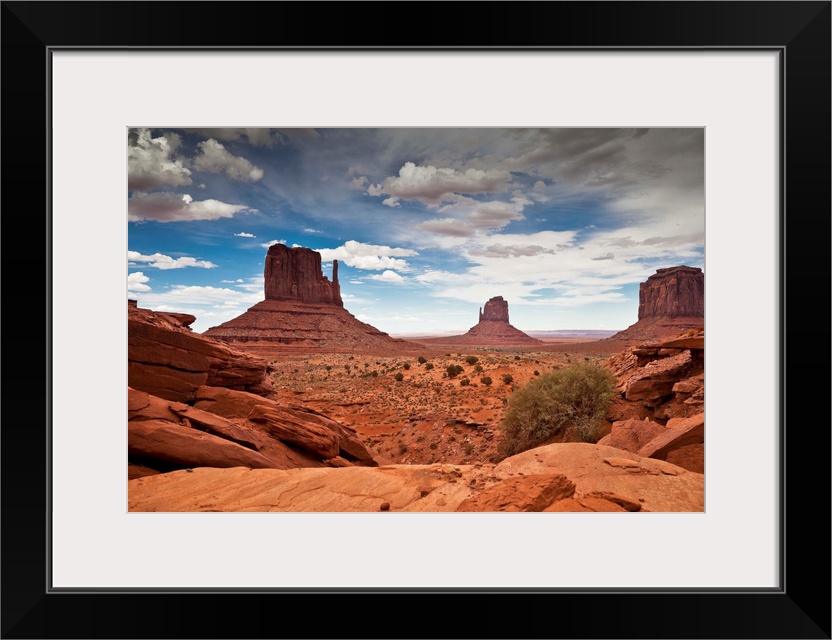 USA, Arizona, Monument Valley Tribal Park, Monument Valley, Navajo Nation sandstone mesas and buttes with impending sandst...