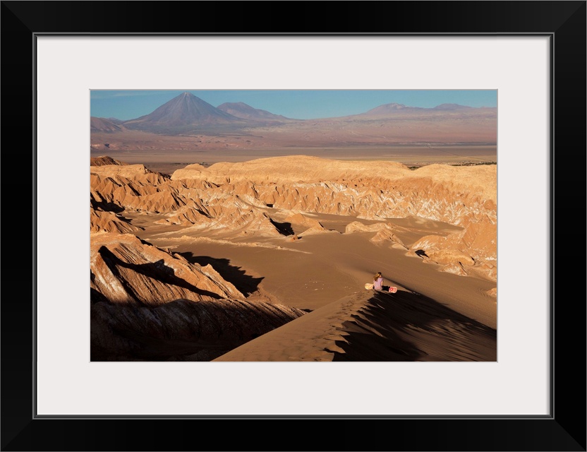 Chile, Antofagasta, Atacama Desert, San Pedro de Atacama, Sand surfing in the Death Valley with Licancabur volcano in the ...