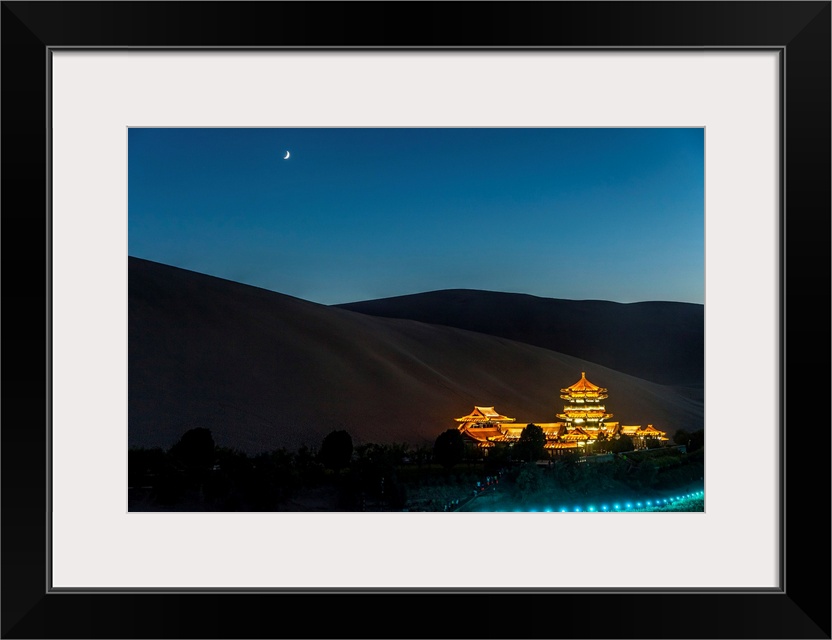 China, Gansu, Dunhuang, Crescent lake and the oasi out of the city of Dunhuang by night.