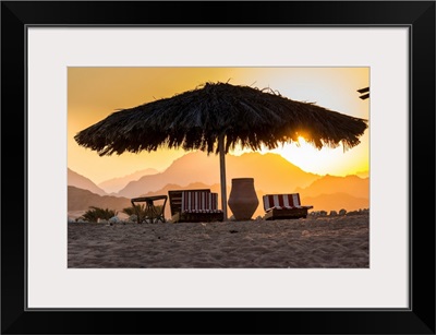 Egypt, Sharm El Sheikh, Nabq Bay, Beach Beds At Sunset With Sinais Mountains Behind