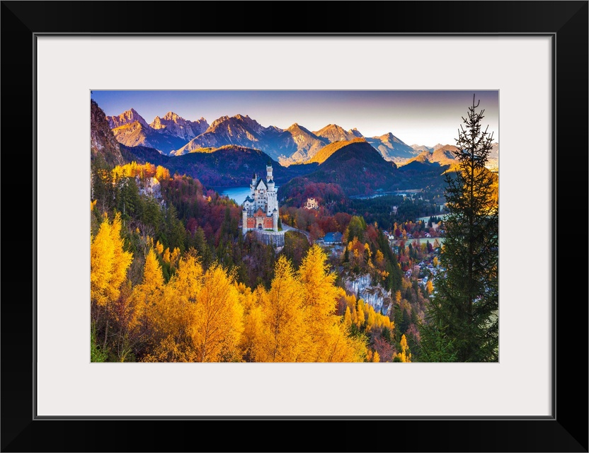 Germany, Bavaria, Neuschwanstein Castle and Hohenschwangau Castle with Lake Alpsee and Tannheim Mountains.