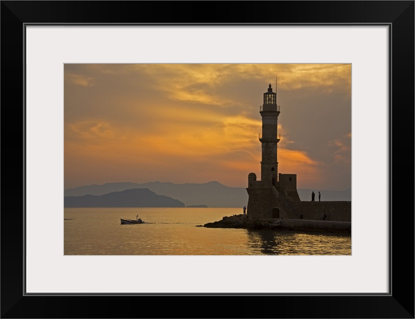 Greece, Crete, Chania, Venetian lighthouse in Chania harbor at sunset