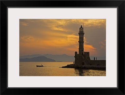 Greece, Crete, Chania, Venetian lighthouse in Chania harbor at sunset