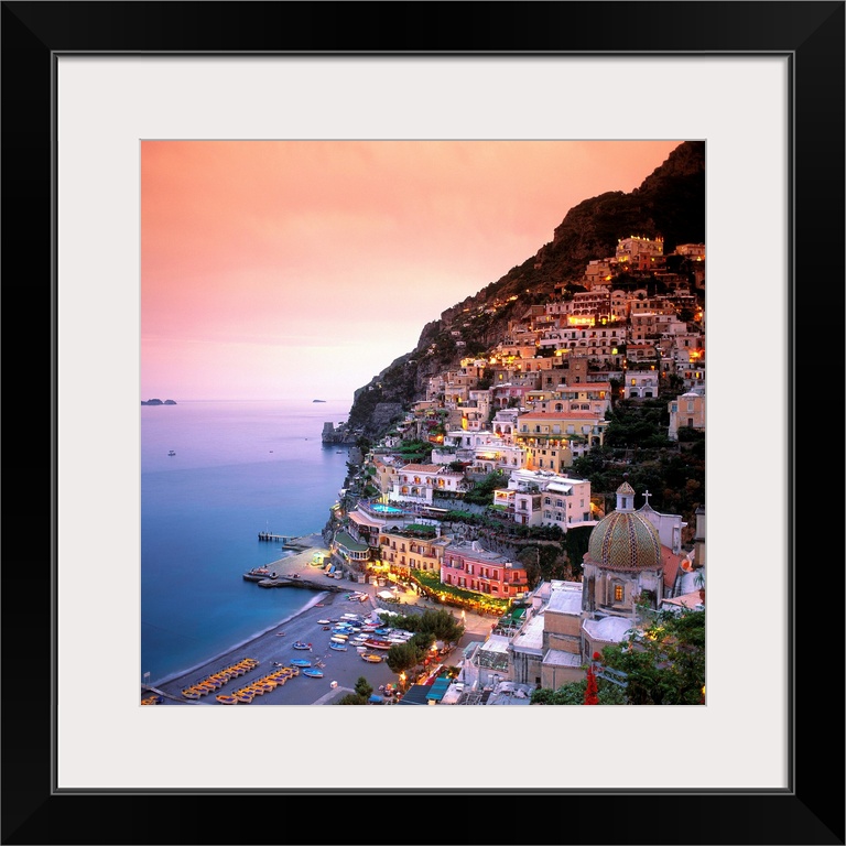 A square shaped photograph of the charming Italian town of Positano at sunset. Built into the cliffs overlooking the Medit...