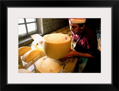 Italy, Parma district, Parmigiano Reggiano, shapes in tub of salting