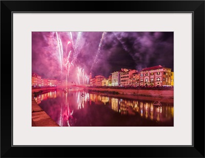 Italy, Pisa, Fireworks at the Arno River waterfront during the Luminara di San Ranieri