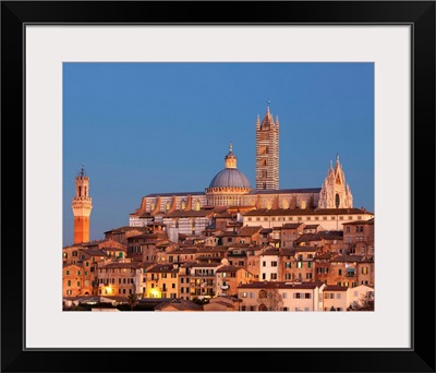 Italy, Siena, City at sunset with the cathedral in the background