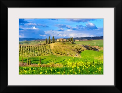Italy, Tuscany, Orcia Valley, Hilly Landscape With Farmhouse And Blooming Fields