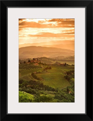 Italy, Tuscany, Val d'Elsa, Sunrise over a typical rural Tuscan landscape