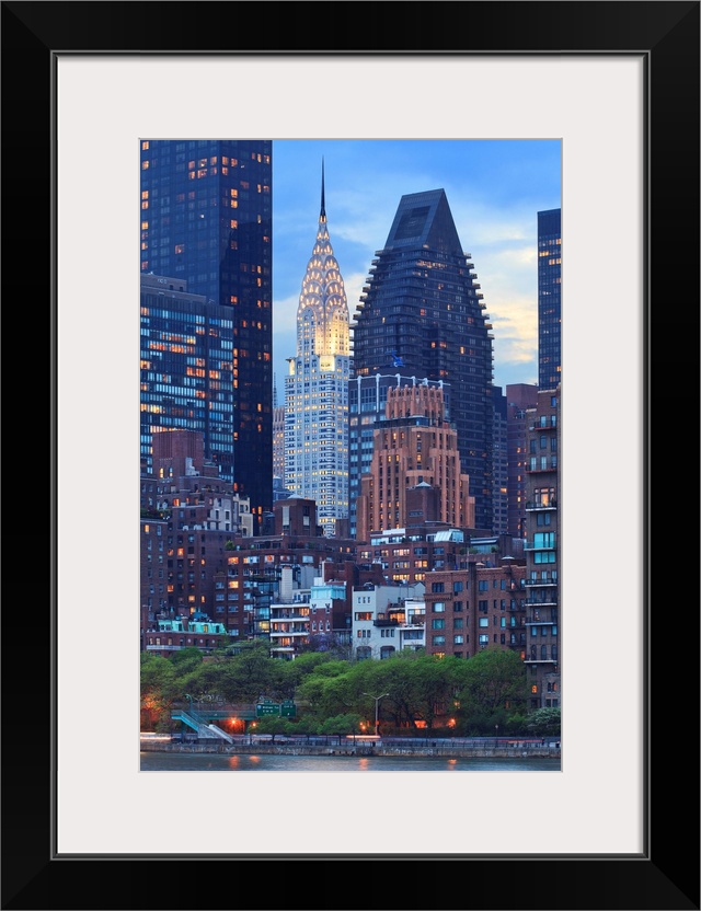 USA, New York City, Manhattan, Midtown, Chrysler Building, View towards Manhattan at dusk from Roosevelt Island.