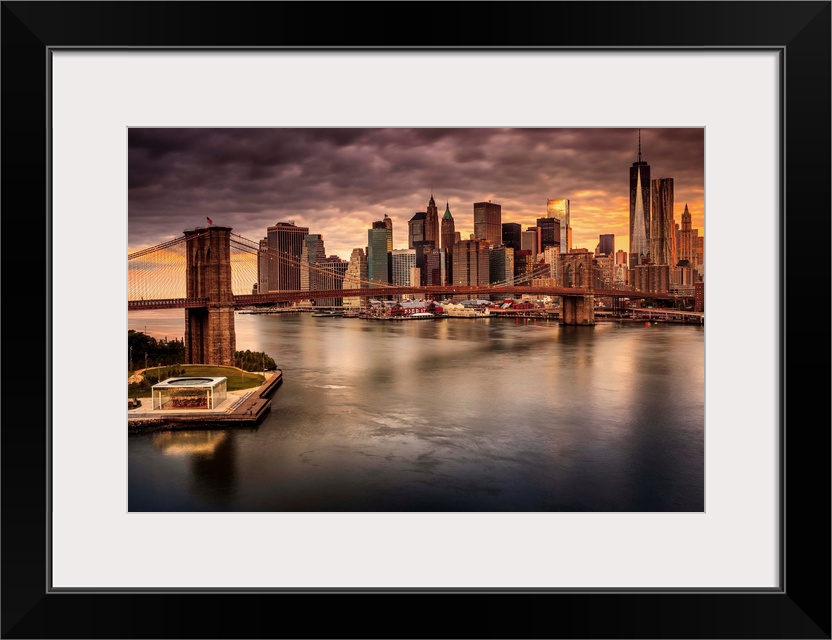 USA, New York City, East River, Manhattan, Brooklyn Bridge, Brooklyn Bridge and Manhattan skyline at sunrise.