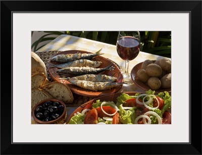 Portugal, Typical rustic Algarve meal, grilled sardines, bread, salad & a glass of wine