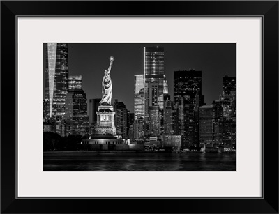 USA, New York City, Lower Manhattan Skyline And Statue Of Liberty At Night