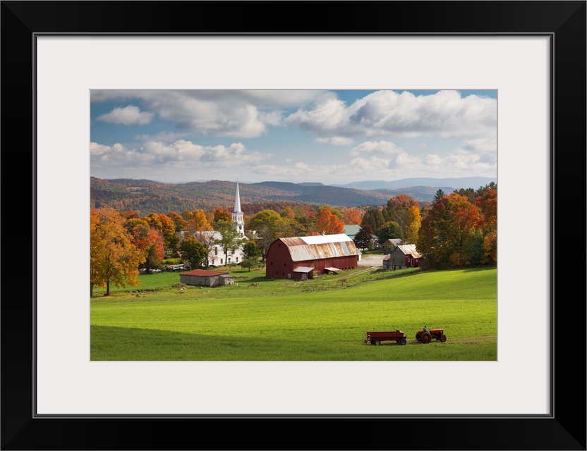 USA, Vermont, Peacham, New England, Tractor passing the village in the fall.