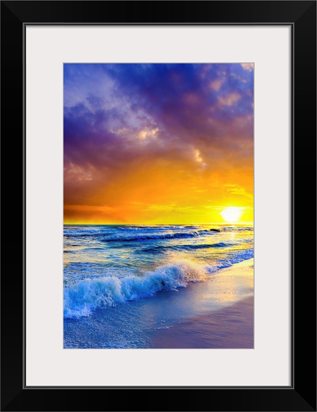 Purple clouds reach out beyond an orange sunset over the ocean. A great sunset to print on canvas.