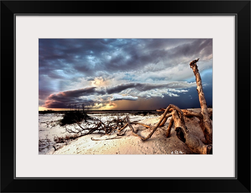 Dark thunder storm clouds over a desert landscape.