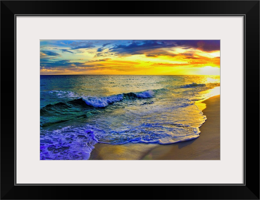 Image of waves rolling over Navarre beach before a dark yellow sunset seascape. Landscape taken on Navarre Beach, Florida.