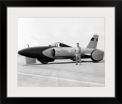 Craig Breedlove stands beside his jet car 'Spirit of America'