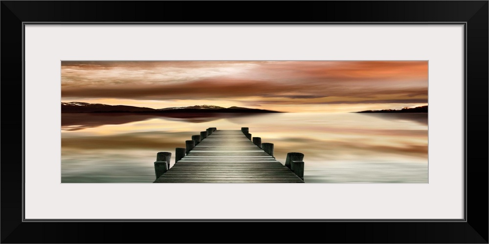Photograph of a wooden dock with a dream-like sunset.