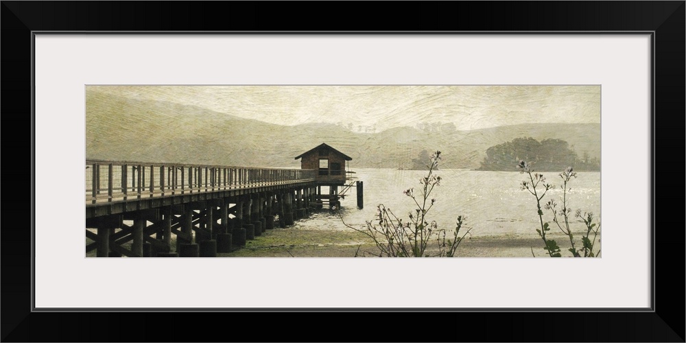 Wide angle, fine art photograph of a pier extending into the water, a small hut at the end.  An overcast day, with swirlin...