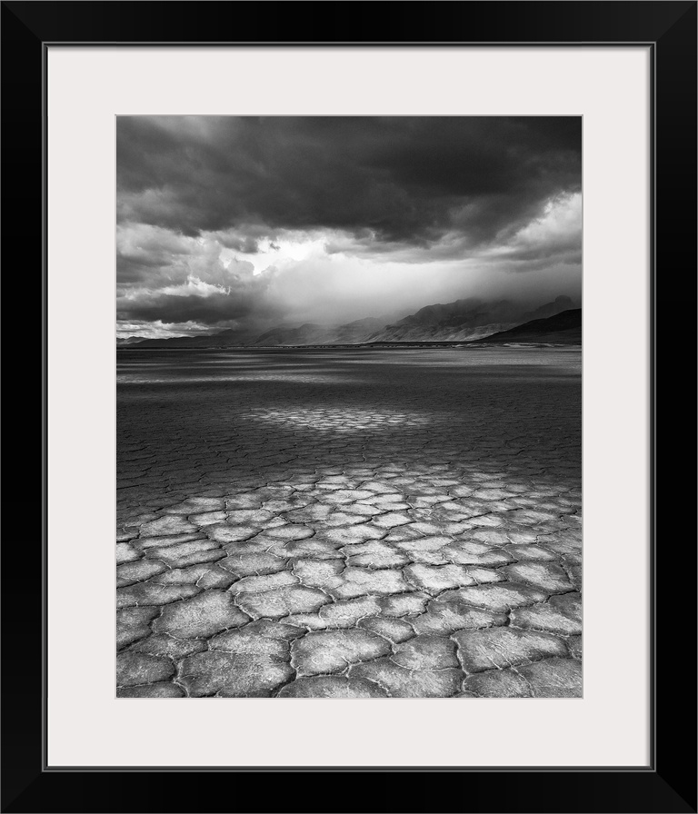 A rainstorm travels over Steens Mountain as seen from the Alvord Desert in Oregon.