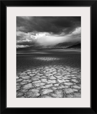 A rainstorm travels over Steens Mountain as seen from the Alvord Desert in Oregon.