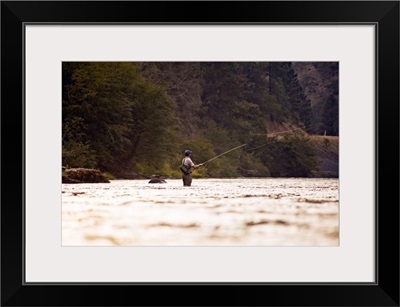 A young man fly fishing on the Klickitat River.