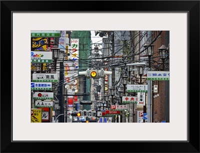 Amerikamura district, with chaos of street signs, lights, advertising and wires.