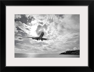 An airliner comes in for a landing in St Maarten, Netherlands Antilles.