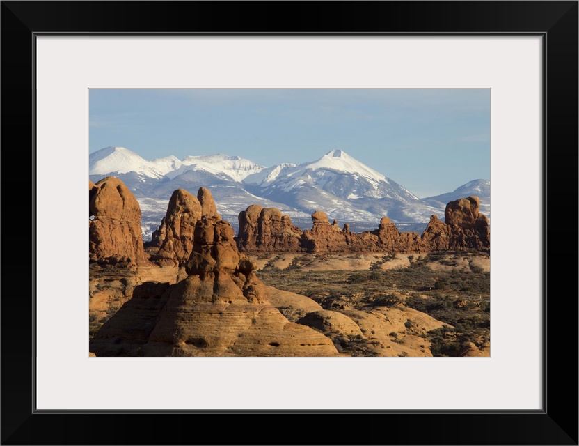 The snow-capped montains of the La Sal Mountain range is visible in the background.