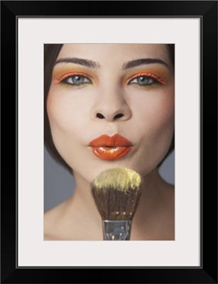 Beauty portrait of woman flowing make up of brush
