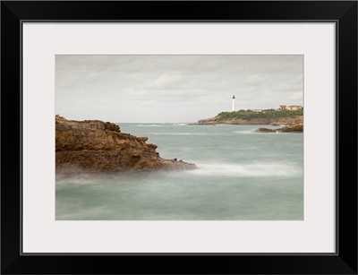 Biarritz Lighthouse with rocks and sea.