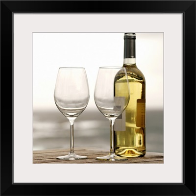 bottle of white wine and two glasses