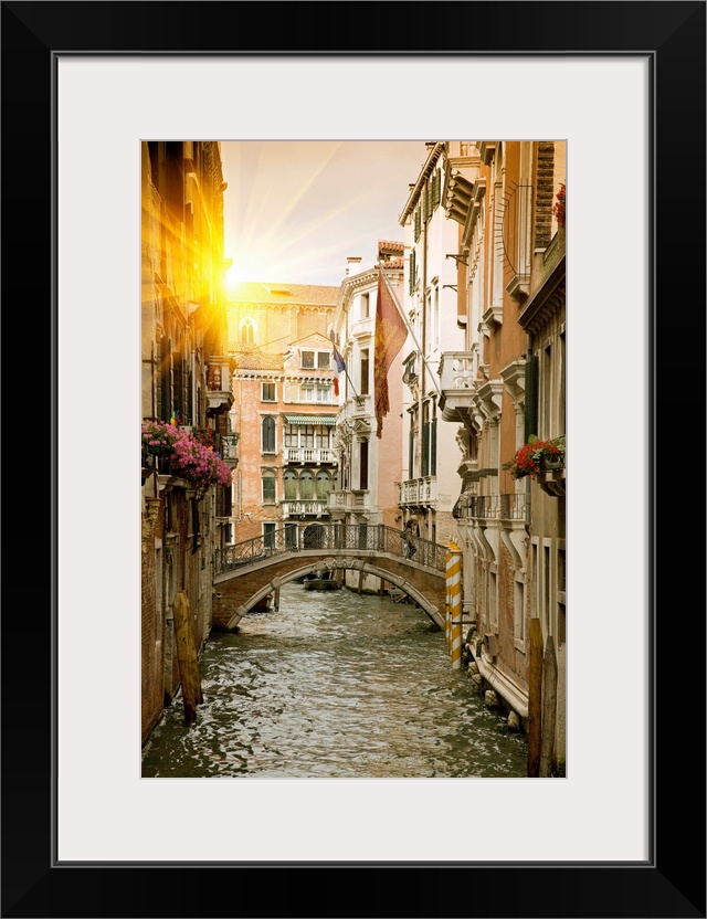 Large portrait wall hanging of buildings and a bridge in a canal in Venice, Italy.