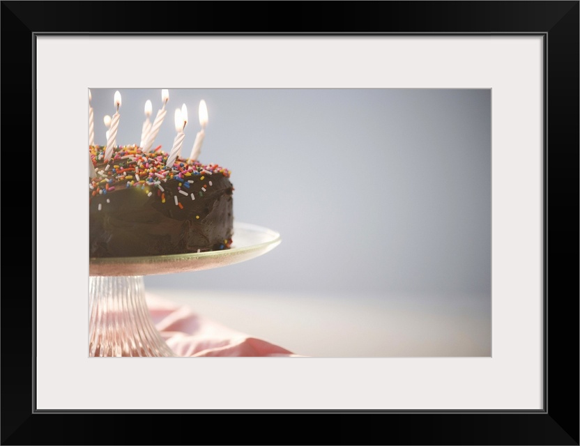 Close up of chocolate birthday cake with candles