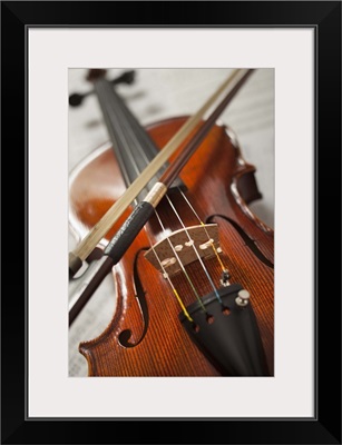 Close-up of violin on sheet music