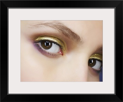 Closeup of eyes with gold eyeshadow