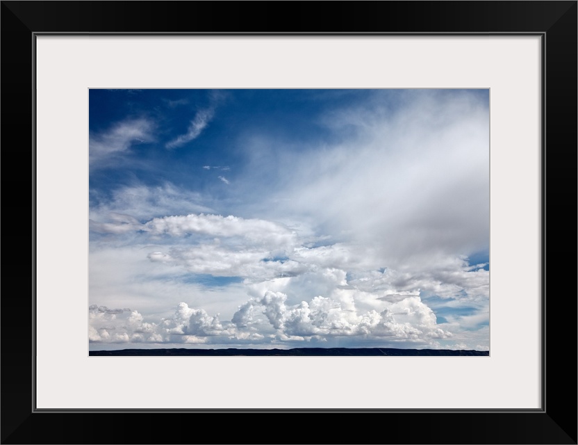 Dramatic clouds in sky over mesa in Abo, NM