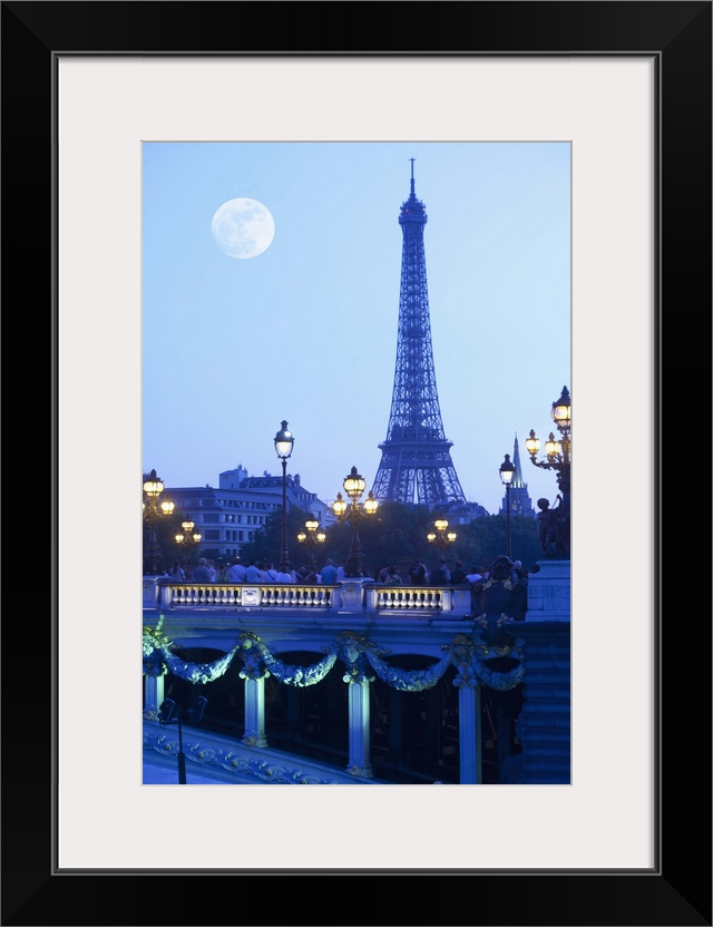 Eiffel tower at dusk with moonrise